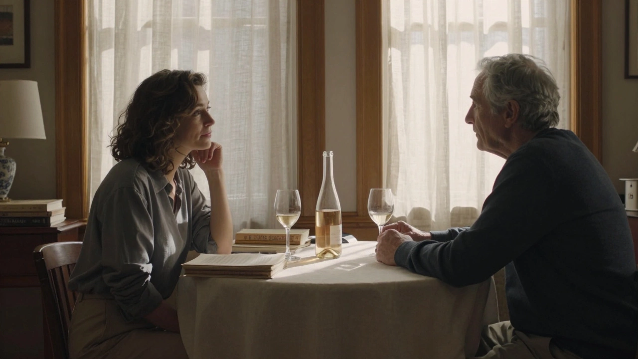 A woman and older man sit at a dining table in Montmartre, talking softly over wine amidst art books and afternoon light.